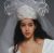 Jill Dent bridal dress design with bride's hat and veil